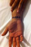 PARLA inked on wrist
